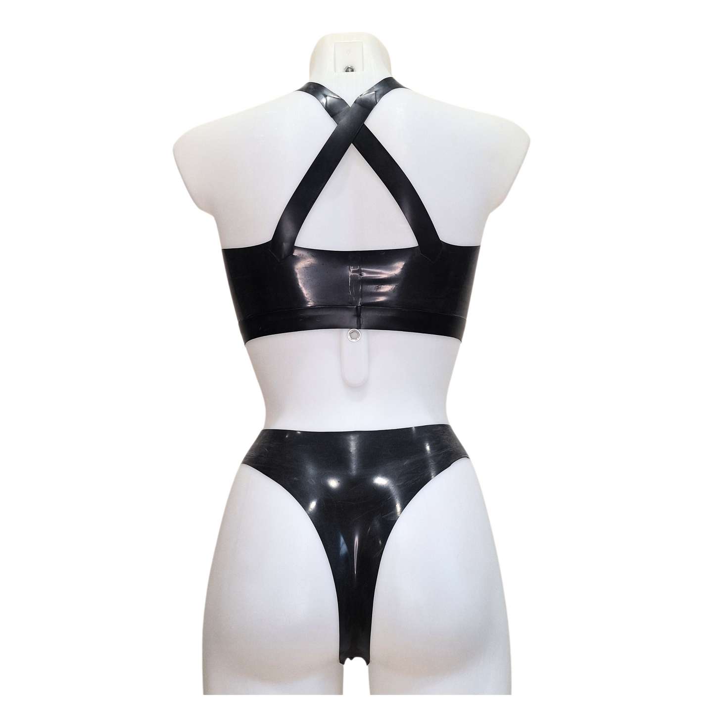 Latex high waisted, high leg thong knickers/panties shown with a lack latex cross front (under collar bone) cropped top - back view