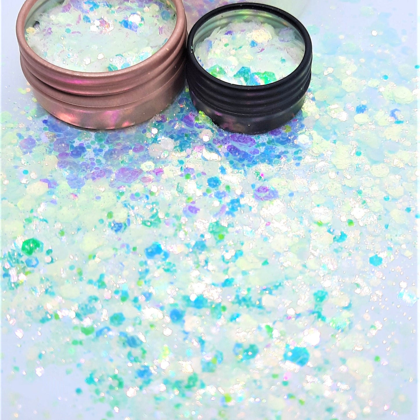 Mermaid Tears Glitter Mix  An iridescent white with hints of aqua greens depending on the light, so pretty!